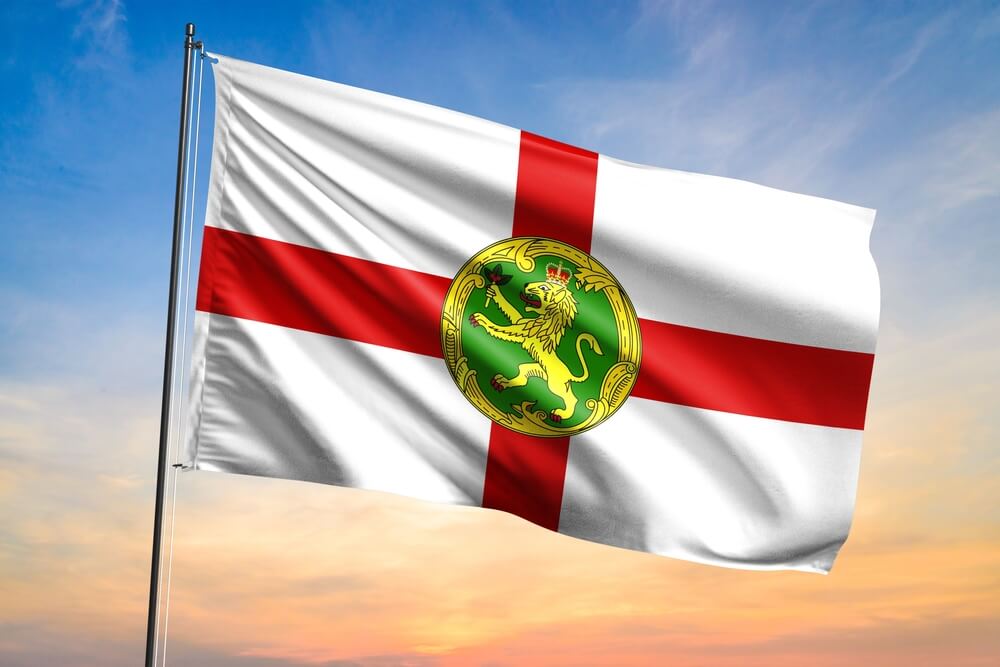 Flag,Of,Alderney,Waving,Flag,On,Sunset,View